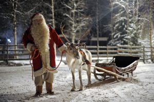 Santa Claus prepars his Reindeer and sled in Rovaniemi, on December 16, 2008. Rovaniemi's Christmas theme park is in full swing, teeming mainly with families with children eager to meet Santa and his elves. In 2007, almost one million tourists visited Finnish Lapland above the Arctic Circle, 360,000 of whom were foreigners, mainly from Britain, Germany, France, the Netherlands, Norway and Russia, according to the regional council of Lapland. AFP PHOTO / OLIVIER MORIN (Photo credit should read OLIVIER MORIN/AFP/Getty Images)